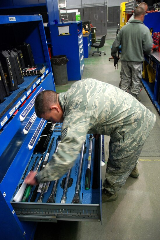 Technical Sgt. Brandon Ives, 439th Airlift Wing, Aircraft Maintenance Squadron, checks in and accounts for tools at the end of a late night shift.