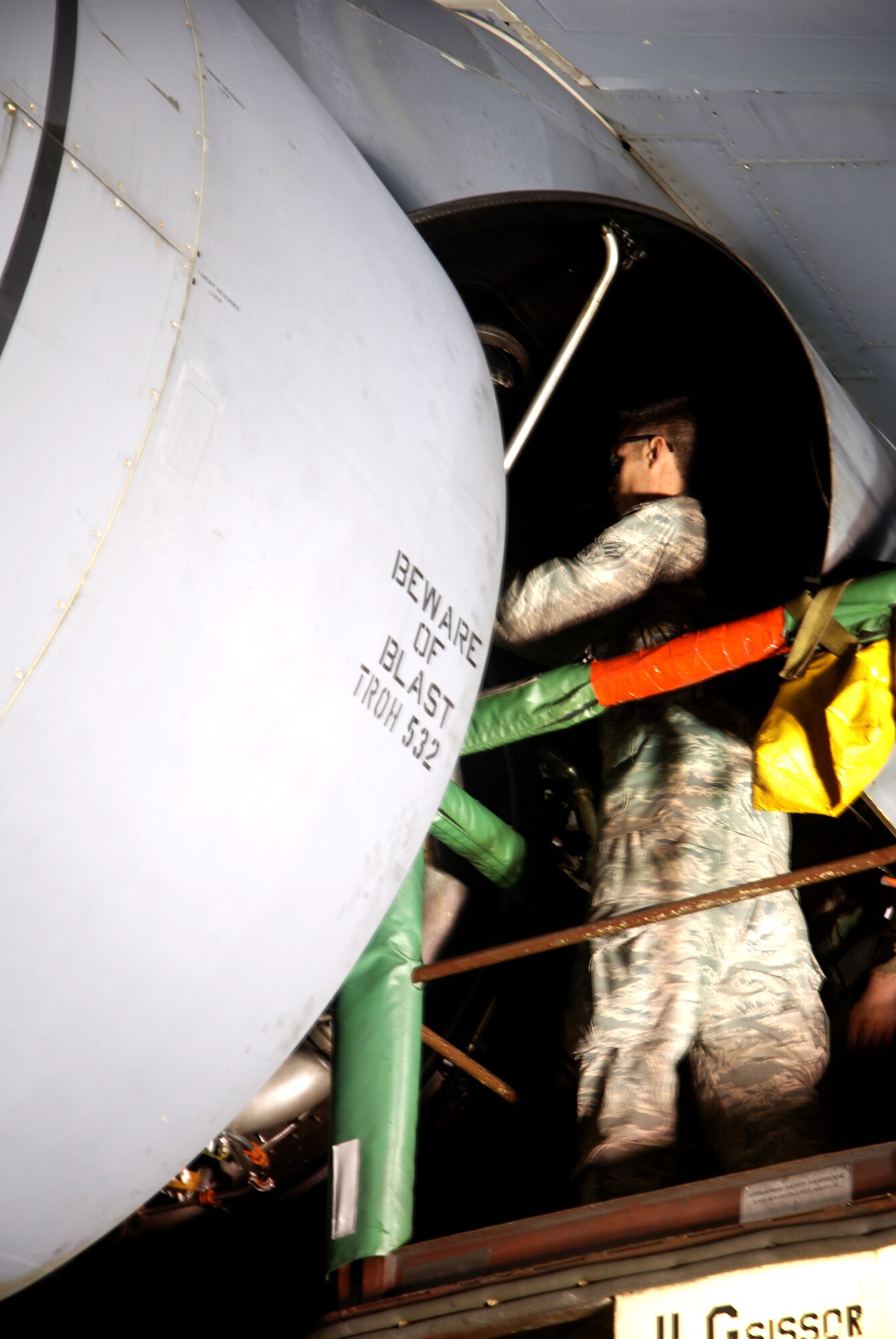 Senior Airman Zach Allard, 439th Aircraft Maintenance Squadron, does an oil change on a Westover C-5's General Electric TF-39 engines during the overnight hours.  Westover has moved to 24-hour operations in support of Operation Enduring Freedom.