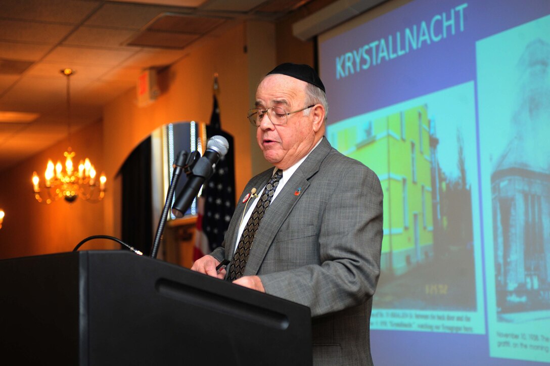 Dr. Rudolph Jacobson recounts the story of the holocaust he witnessed as a child in Nazi Germany in the late 1930s.  Here he touches on what happened the night history calls Krystallnacht, in which 267 synagogues were burned, including his own.  The night after Krystallnacht, his step-father was arrested and sent to a concentration camp. Dr. Jacobson reminded the audience not to forget history and to never stand idly by if others are victimized by hate. (Air Force photo/Airman 1st Class Corey Hook)