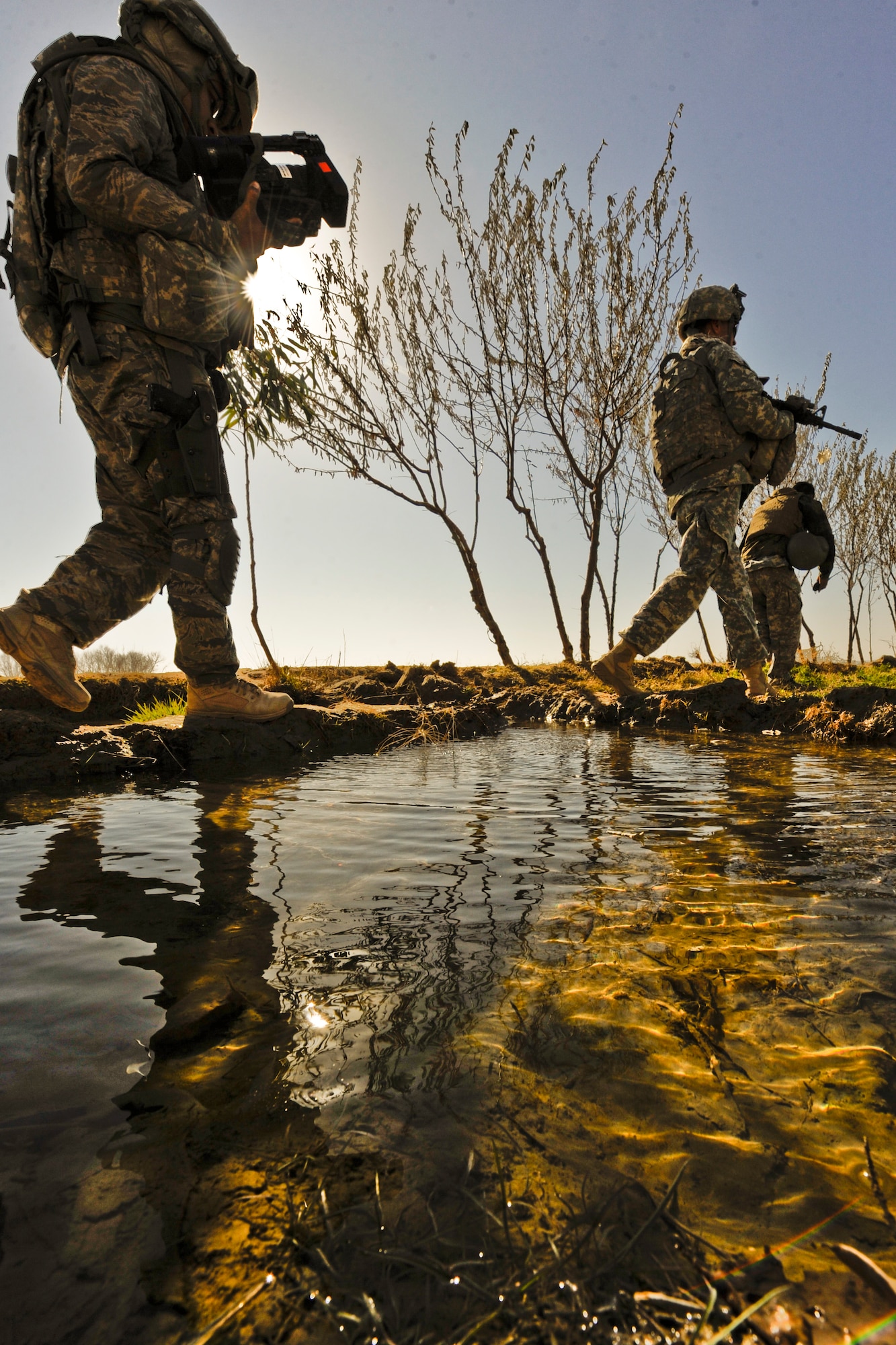 Tech. Sgt. Rodolfo Castro documents Soldiers with the Headquarters and Headquarters Company of 4th Battalion, 23th Infantry Regiment, conducting a foot patrol Jan. 15, 2010, in Helmand province, Afghanistan. (U.S. Air Force photo/Tech. Sgt. Efren Lopez)