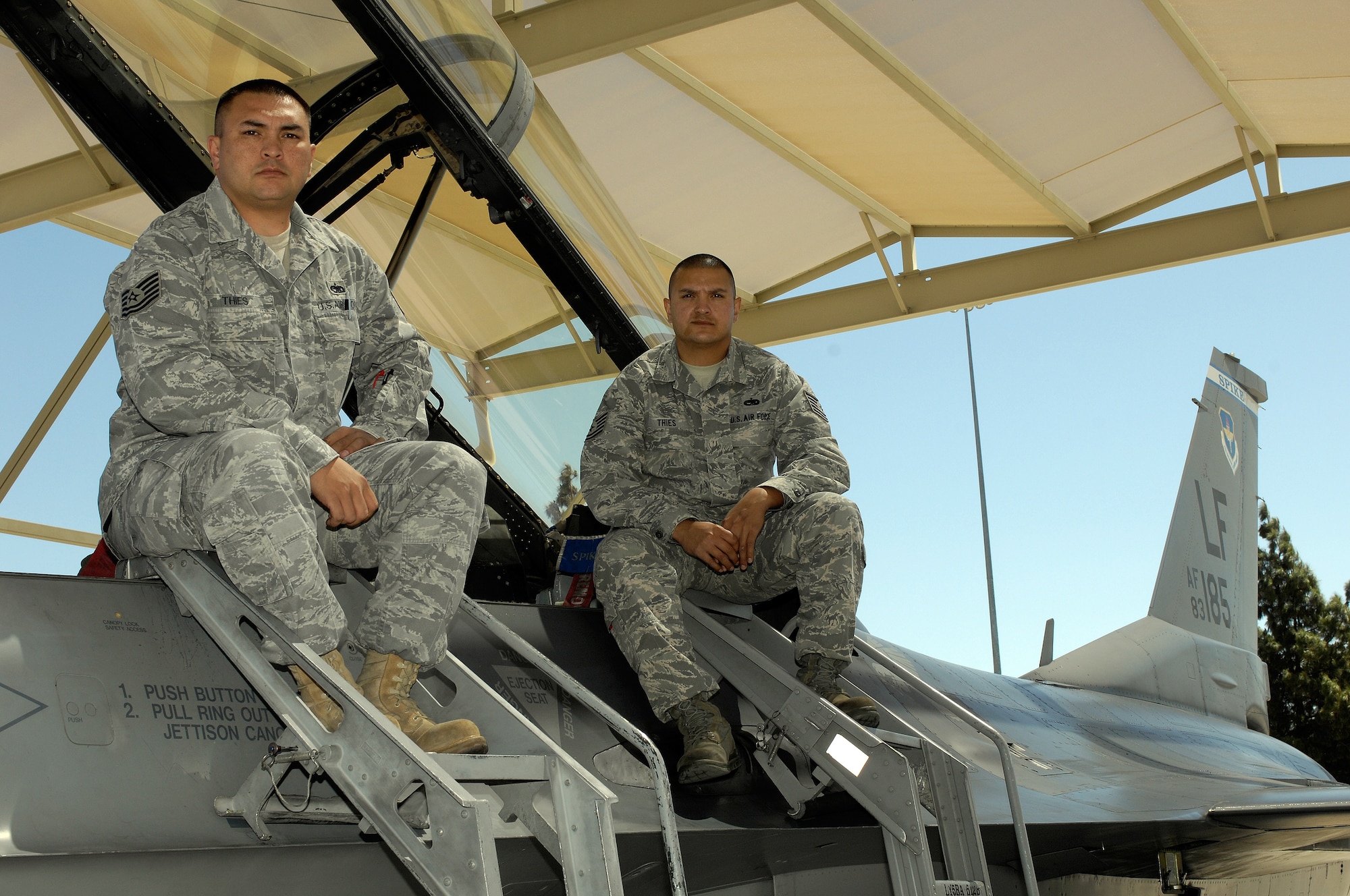 Tech. Sgts. Poun and David Thies, brothers and 56th Maintenance Group crew chiefs, pose for a photo April 5 at Luke. The brothers have served on active duty for 14 and 11 years, respectively. (U.S. Air Force photo by Staff Sgt. Jason Colbert)