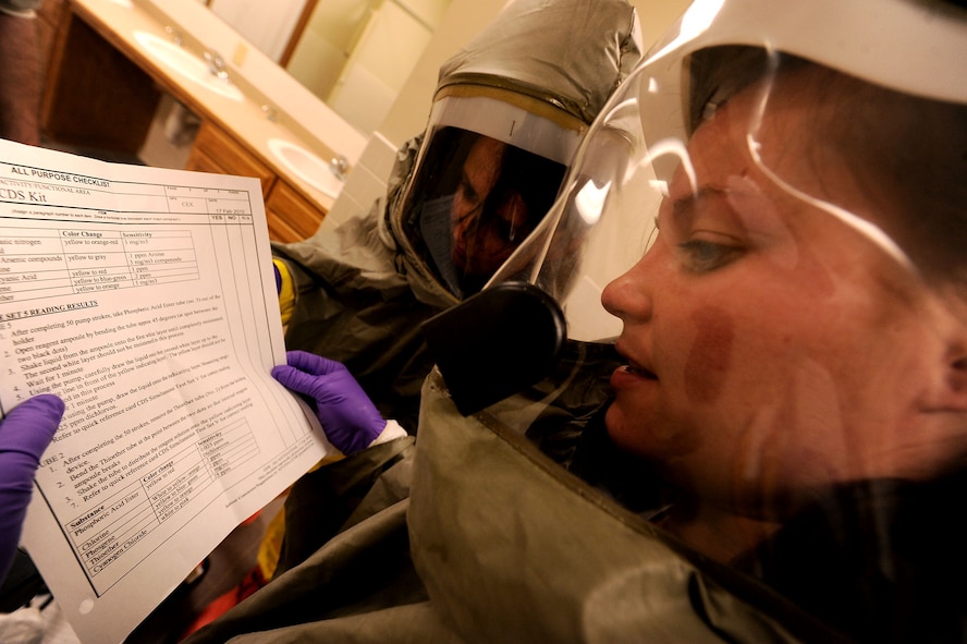 MOODY AIR FORCE BASE, Ga. -- Airmen 1st Class Jennifer Forsythe, 23rd Aeromedical Dental Squadron bioenvironmental journeyman, reads off a checklist while getting the calculation for a chemical threat during the Air Combat Command Chemical, Biological, Radiological and Nuclear Challenge here April 6. The checklist gives step by step instructions on how to obtain correct readings of a chemical threat. (U.S. Air Force photo by Airman 1st Class Joshua Green/RELEASED)