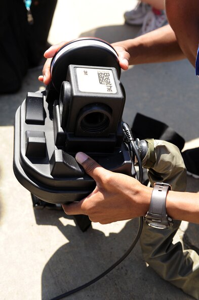 MOODY AIR FORCE BASE, Ga. -- Senior Airman Janese Thompson, 23rd Aeromedical Dental Squadron bioenvironmental journeyman, places filters on a power supply air purification unit during the Air Combat Command Chemical, Biological, Radiological and Nuclear Challenge here April 6. The PAPR unit supplies clean air to any person wearing a chemical suit while they are within an area affected by an airborne chemical threat. (U.S. Air Force photo by Airman 1st Class Joshua Green/RELEASED)