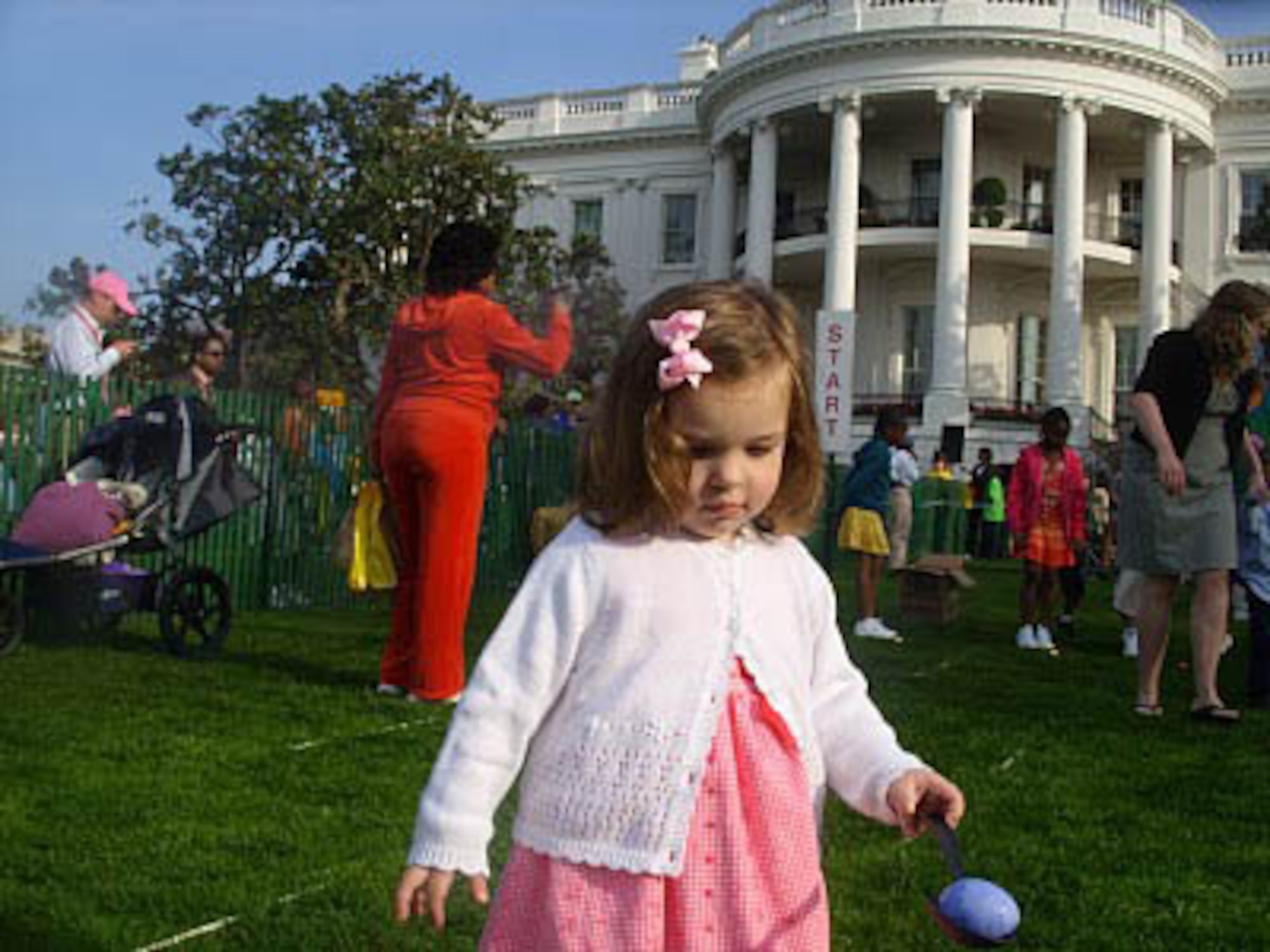 JOINT BASE MCGUIRE-DIX-LAKEHURST, N.J. - Ava Von Dauber, 2, daughter of Master Sgt. Bernard K. Von Dauber III, here, takes part April 5, in the White House Easter Egg Roll. Fifity JB MDL members were selected to attend the annual event held on the South Lawn. (U.S. Air Force photo)