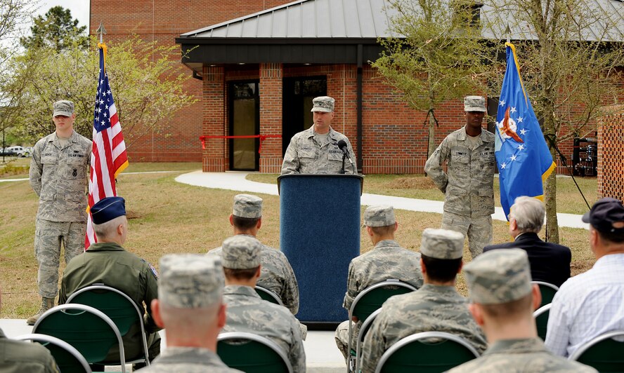 MOODY AIR FORCE BASE, Ga. -- Col. William DeMaso, 23rd Wing vice commander, provides his opening remarks at a ribbon-cutting ceremony celebrating the completion of the new base dormitory called “Dorm 4-Airmen” here April 8. Each Airman gets their own room, but shares a common area furnished with couches, a TV and a complete dining area. (U.S. Air Force photo by Airman Class Joshua Green)