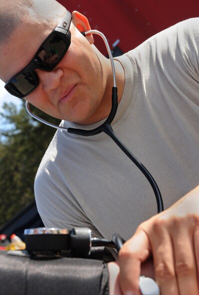 MOODY AIR FORCE BASE, Ga. -- Tech. Sgt. Raymond Garcia, 38th Rescue Squadron independent-duty medical technician, takes the vital signs of a participant during the Air Combat Command Chemical, Biological, Radiological and Nuclear Challenge after a scenario here April 7. Sergeant Garcia checks for heart rate, blood pressure and respirations to ensure that the participant can continue to conduct scenarios. (U.S. Air Force photo by Airman 1st Class Benjamin Wiseman/RELEASED)