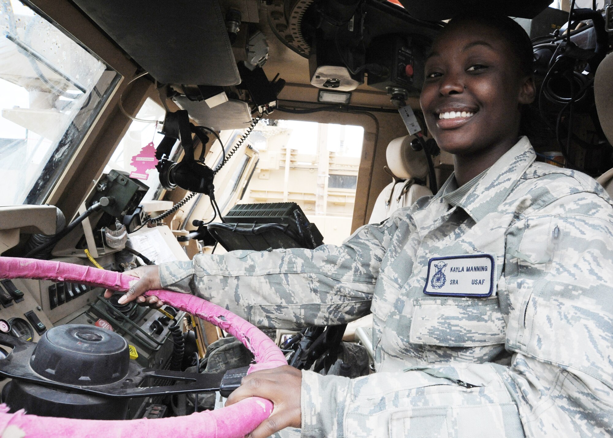Senior Airman Kayla Manning sits at the wheel of her mine-resistant, ambush-protected vehicle before heading out on a mission March 27, 2010, at Camp Stryker, Iraq. Airman Manning is from the 732nd Expeditionary Security Forces Squadron, Det. 2. (U.S. Air Force photo/Master Sgt. Trish Bunting)
