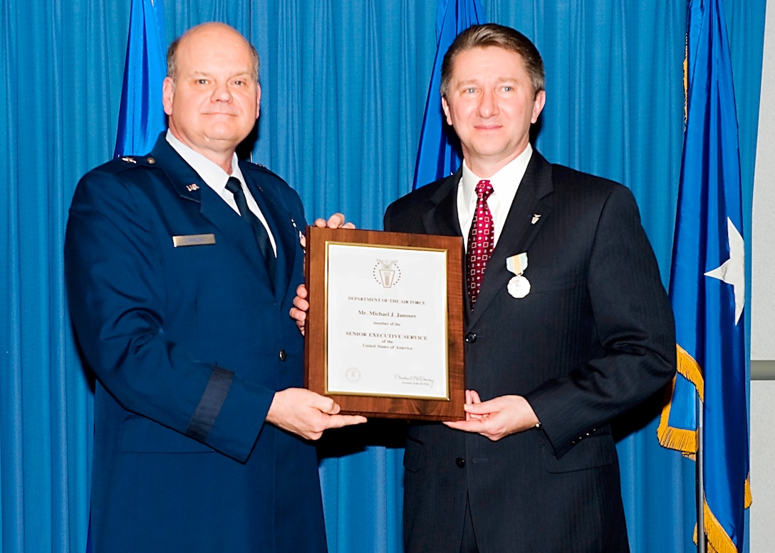 Brig. Gen. Dana Simmons, OSI/CC, hosted an induction ceremony for OSI’s newest executive director, Mr. Michael Janosov, SES, March 19, in the AFOSI Headquarters rotunda. Mr. Janosov is AFOSI’s fifth executive director.  He replaces Mr. Doug Thomas who retired last year. (U.S. Air Force photo/Mr. Mike Hastings)
