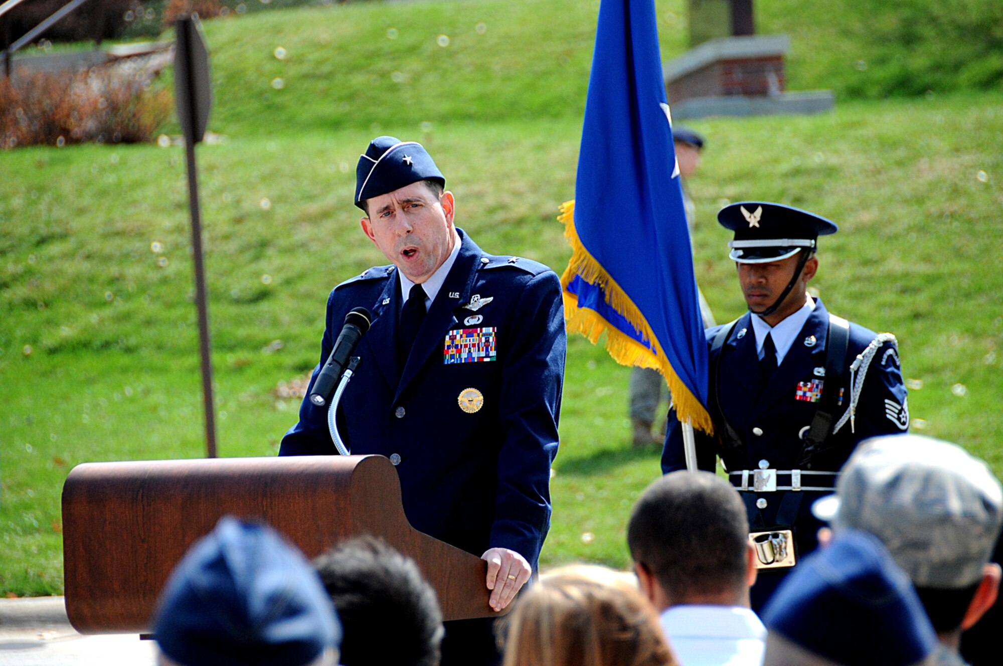 OFFUTT AIR FORCE BASE, Neb. -- 55th Wing Commander Brig. Gen. John N.T. Shanahan, speaks about the impact retired Lt. Col. Harrison "Harry" Tull, a Tuskegee Airman during World War II and a former 55th Wing officer who recently passed away, had on the Air Force, Offutt and the local community during the Tull Road dedication here April 6. The road was named in honor of Colonel Tull, who served more than 27 years in the Air Force including combat tours in the Korean and Vietnam Wars. U.S. Air Force photo by Kendra Williams