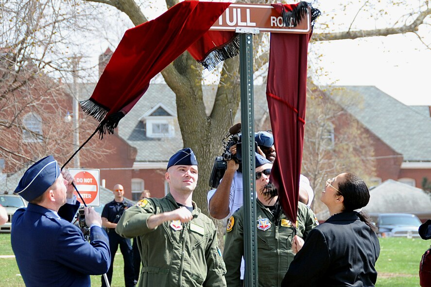 OFFUTT AIR FORCE BASE, Neb. -- 55th Wing Commander Brig. Gen. John N.T. Shanahan and Dr. Janet Tull, the daughter of retired Lt. Col. Harrison "Harry" Tull, a Tuskegee Airman during World War II and a former 55th Wing officer who recently passed away, unveil the road sign for the newly dedicated Tull Road here April 6. The road was named in honor of Colonel Tull, who served more than 27 years in the Air Force including combat tours in the Korean and Vietnam Wars. U.S. Air Force photo by Kendra Williams
