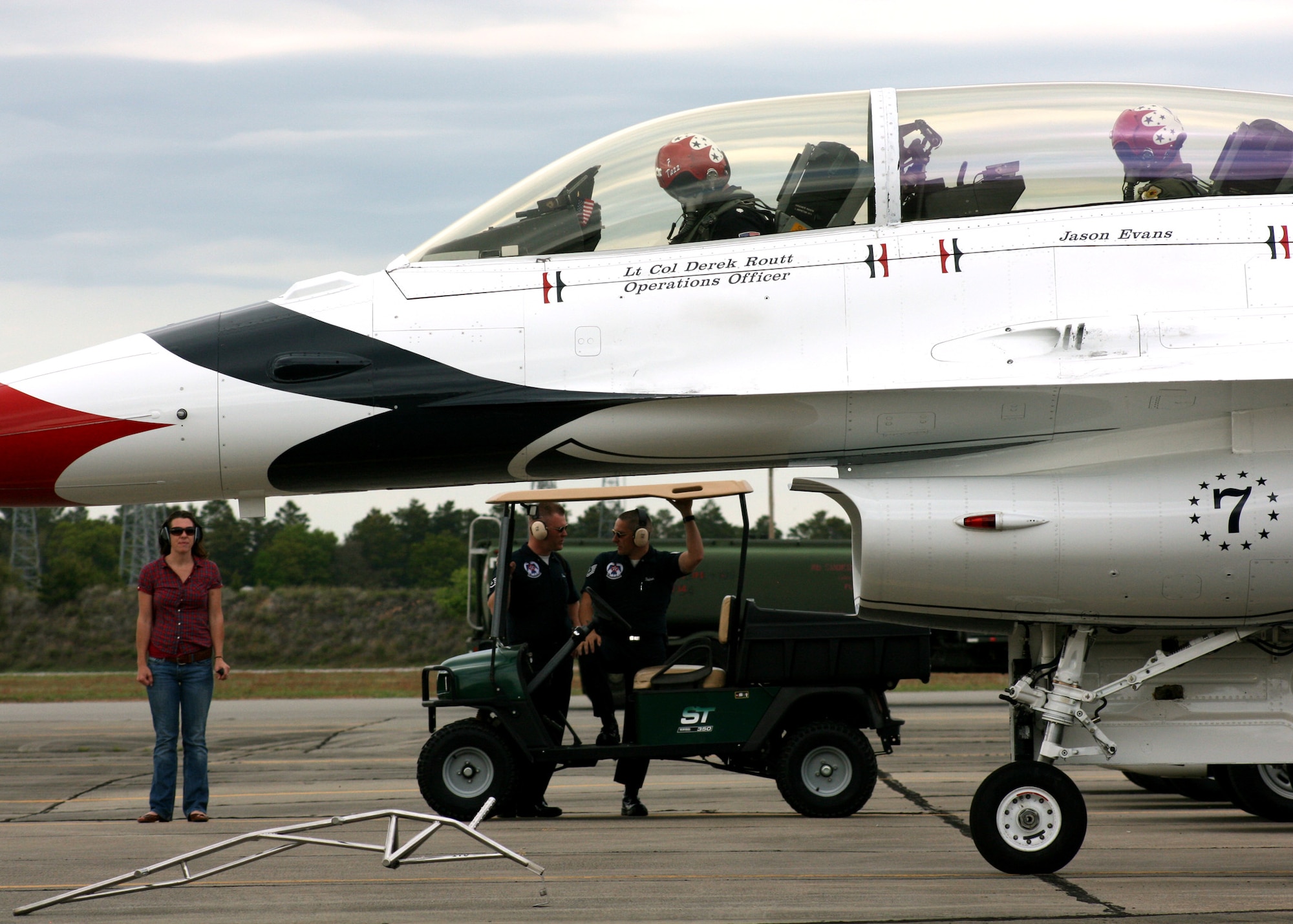 Milissa Evans watches as her husband Jason Evans prepares to taxi during his incentive flight with the Thunderbirds April 8 at Eglin Air Force Base, Fla.  Mr. Evans was selected as the "Hometown Hero" and received a ride in a Thunderbird F-16.  (U.S. Air Force photo/2nd Lt. Andrew Caulk.)