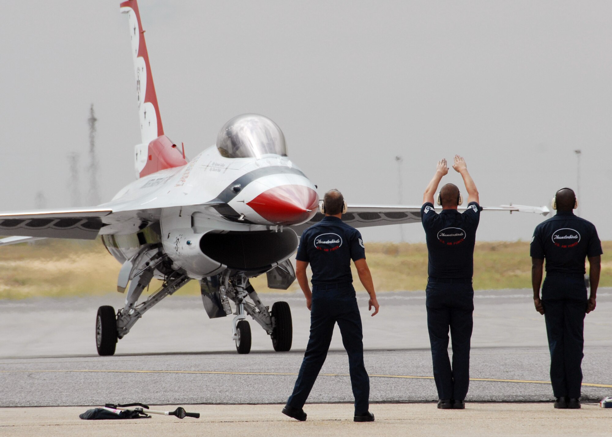 Thunderbird maintainers bring their F-16 onto the flightline at Eglin Air Force Base, Fla., April 8 in preparation for the airshow April 10 and 11.  The T-birds will perform both days with their ground show beginning at 3 p.m.  The airshow begins at 9 a.m. on both days.  See www.eglin.af.mil for more information.  (U.S. Air Force photo/Samuel King Jr.)