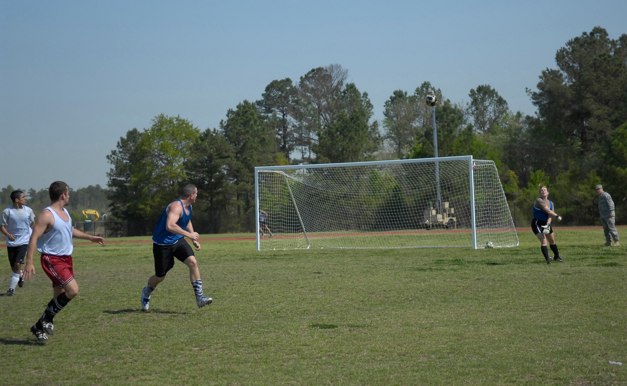 Airman 1st Class Ashley LaGrow, 43rd Comptroller Squadron, throws the ball onto the Pope Soccer Field during a soccer game April 6. Members assigned to the 43rd Wing Staff Agency participate in intramural sports such as soccer to maintain physical fitness. (U.S. Air Force Photo by 2nd Lt. Cammie Quinn)