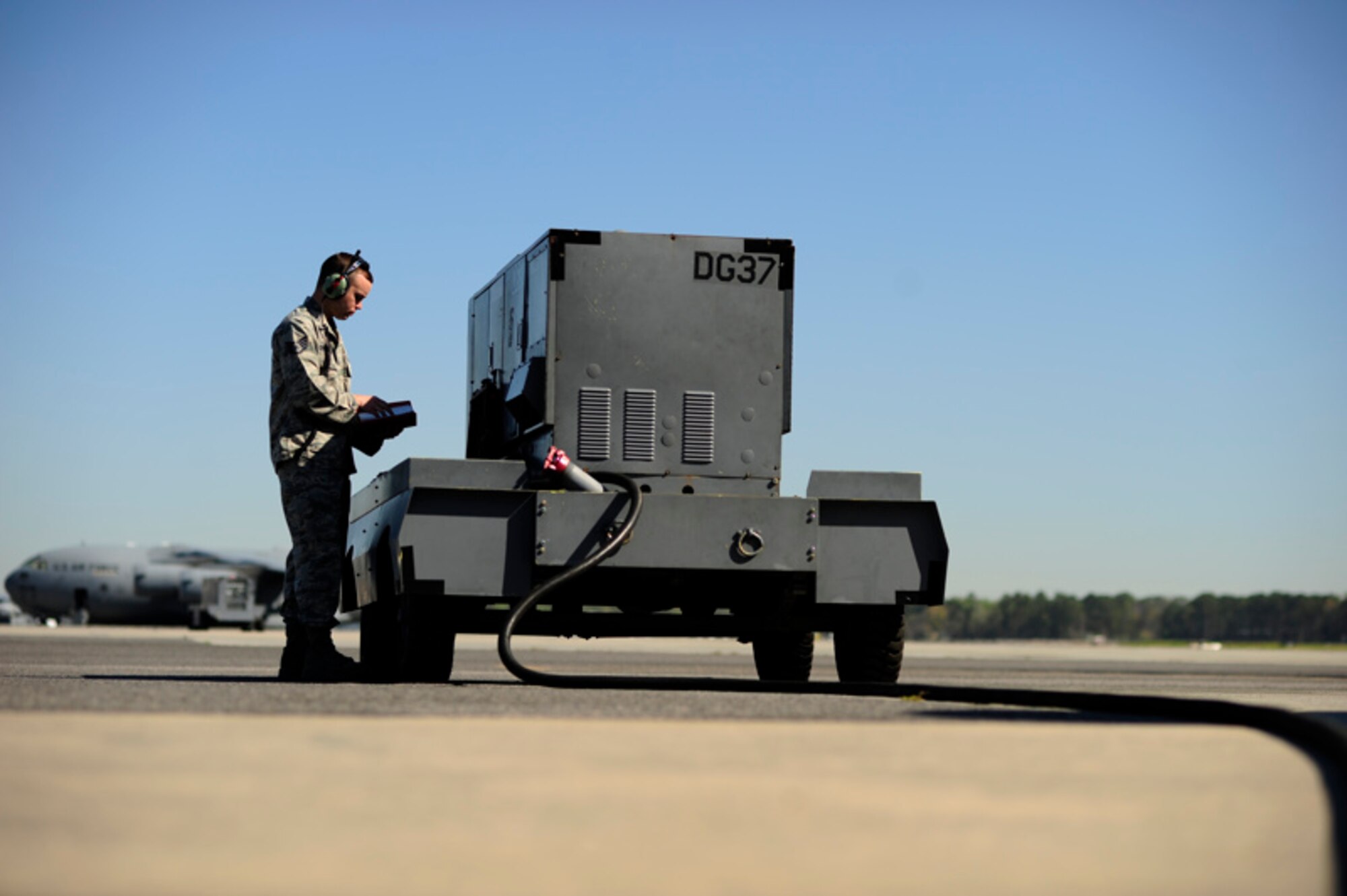U.S. Air Force Staff Sgt. Mike Christenson, a guidance
and flight control technician assigned to the 315th Aircraft Maintenance
Squadron, Charleston Air Force Base, S.C., reviews aircraft information prior to
a training mission on March 31, 2010. (U.S. Air Force photo by Tech Sgt.
Jacob N. Bailey)
