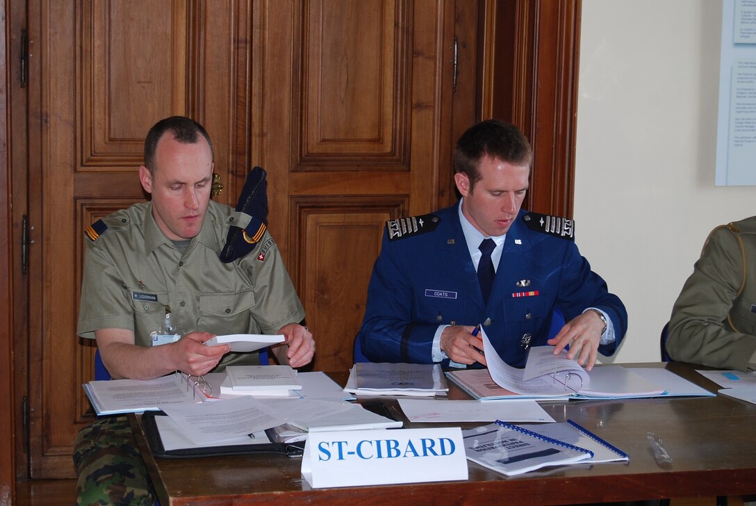 Cadet 1st Class Charlton Coats works with his Swiss teammate, Capt. Mathias Ledermann, at an international service academy Law of Armed Conflict competition in San Remo, Italy, during spring break.  Cadet Coats won the top individual award and the best mixed team award for his work with Captain Ledermann on their mock country, St. Cibard (Photo by Patrizia di Pietro)