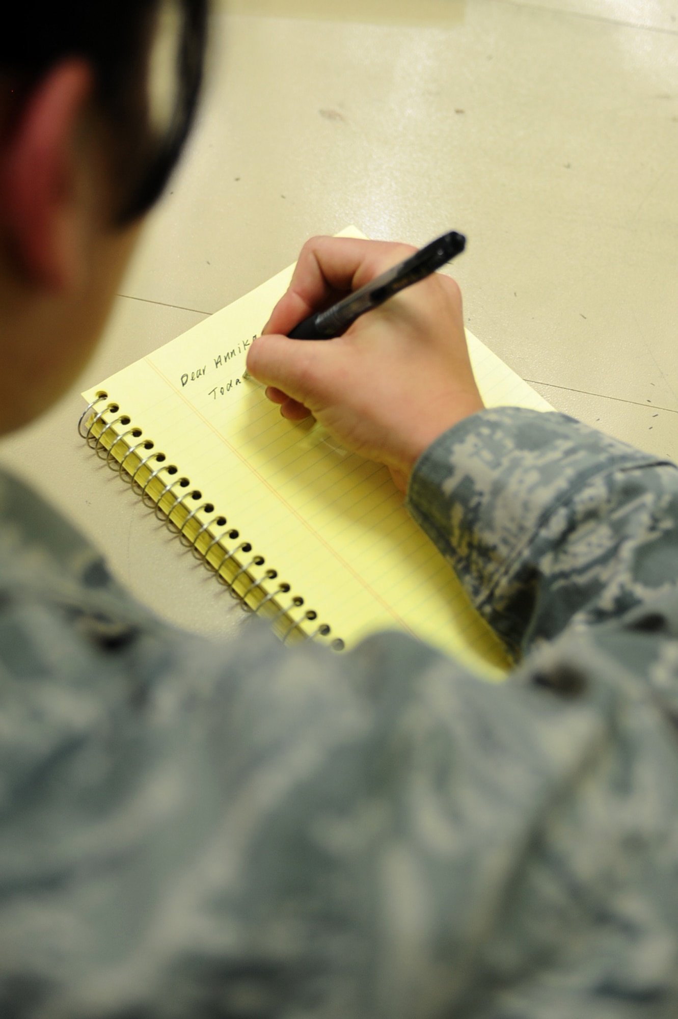 Airman 1st Class Candice Thomas, 379th Expeditionary Maintenance Squadron electro-environmental technician, writes a pen pal letter to a Spring Creek School, S.D., student at a non-disclosed Southwest Asia location March 26, 2010. (U.S. Air Force photo by Senior Airman Kasey Zickmund)[RELEASED]
