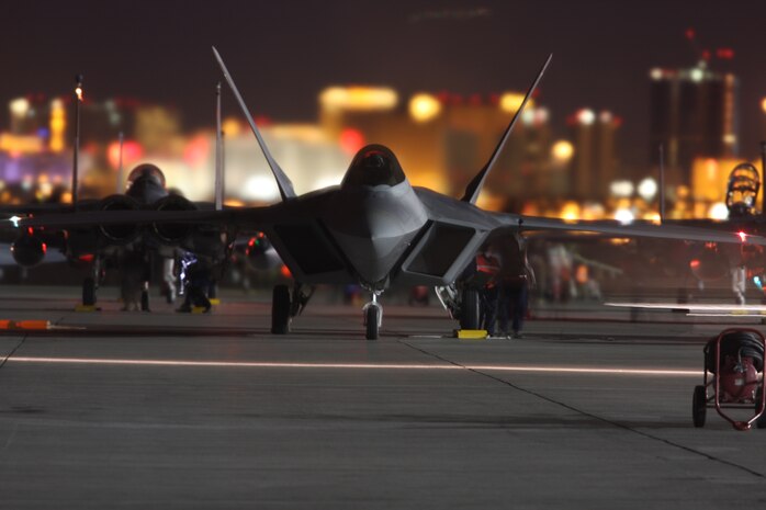 NELLIS AIR FORCE BASE, Nev.-- The lights of the Las Vegas Strip serve as the backdrop for an F-22 Raptor from Holloman Air Force Base, N.M., during Red Flag 10-2.  Red Flag is a realistic combat training exercise involving the air forces of the United States and its allies. The exercise is conducted on the 15,000-square-mile Nevada Test and Training Range, north of Las Vegas.(U.S. Air Force photo by Tech. Sgt. Bucky Parrish)