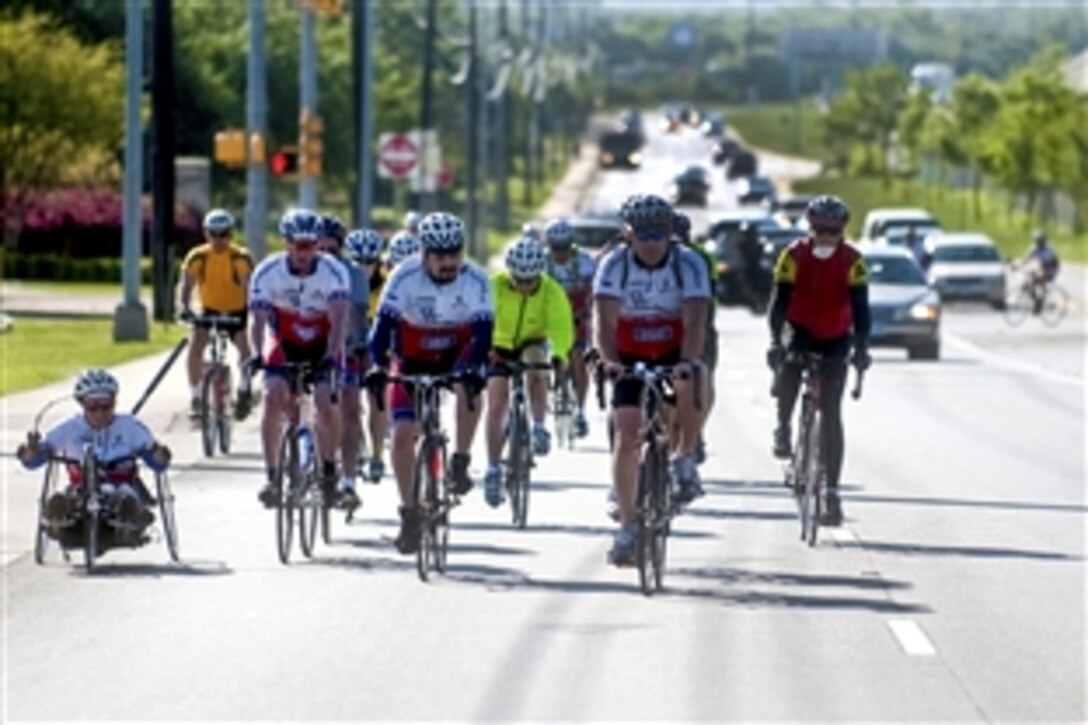 U.S. troops and volunteers join wounded servicemembers to bike 65 miles on Texas roads from Austin to Fort Hood during the "Ride 2 Recovery" bike challenge, April 8, 2010. The event encourages the mental and physical rehabilitation of active duty troops and veterans while promoting awareness of their sacrifices. 