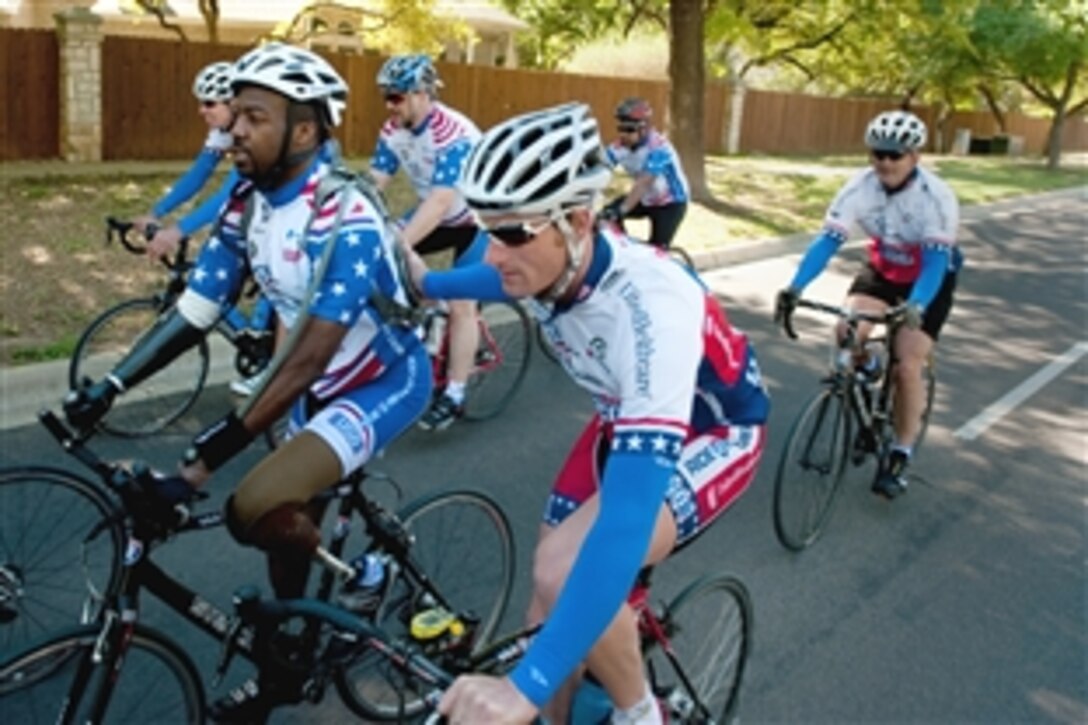 U.S. military servicemembers and volunteers join wounded warriors to bike 65 miles from Austin to Fort Hood, Texas, during the Ride 2 Recovery bike challenge April 8, 2010. Ride 2 Recovery encourages the mental and physical rehabilitation of active-duty servicemembers and veterans and promotes awareness of their sacrifices.