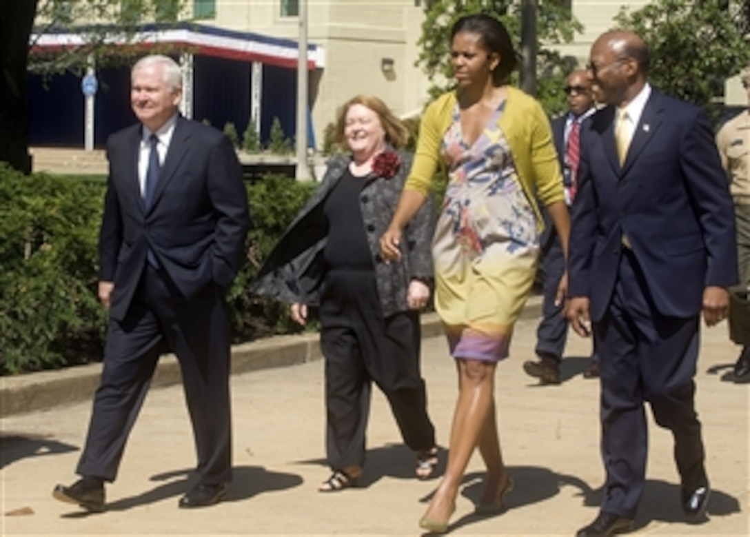 First Lady Michelle Obama walks with Secretary of Defense Robert M. Gates and his wife Becky Gates during a visit to the Pentagon to thank military members and civilian employees for their service on April 9, 2010.  
