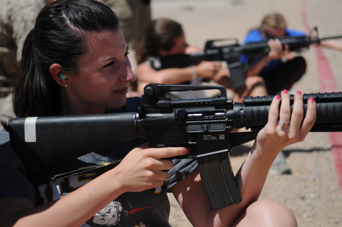 Vanessa Fordoski, Marine Attack Squadron 214 spouse, sights in with an M-16A4 service rifle on the station range at the Marine Corps Air Station in Yuma, Ariz., during VMA-214’s Jane Wayne Day April 9, 2010. Jane Wayne Day allows Corps dependents to spend a day as Marines, learning about what they do and how they train. Thirty-three spouses spent the day doing activities such as weapons training, Marine Corps martial arts, watching Harriers deliver ordnance and running the obstacle course.