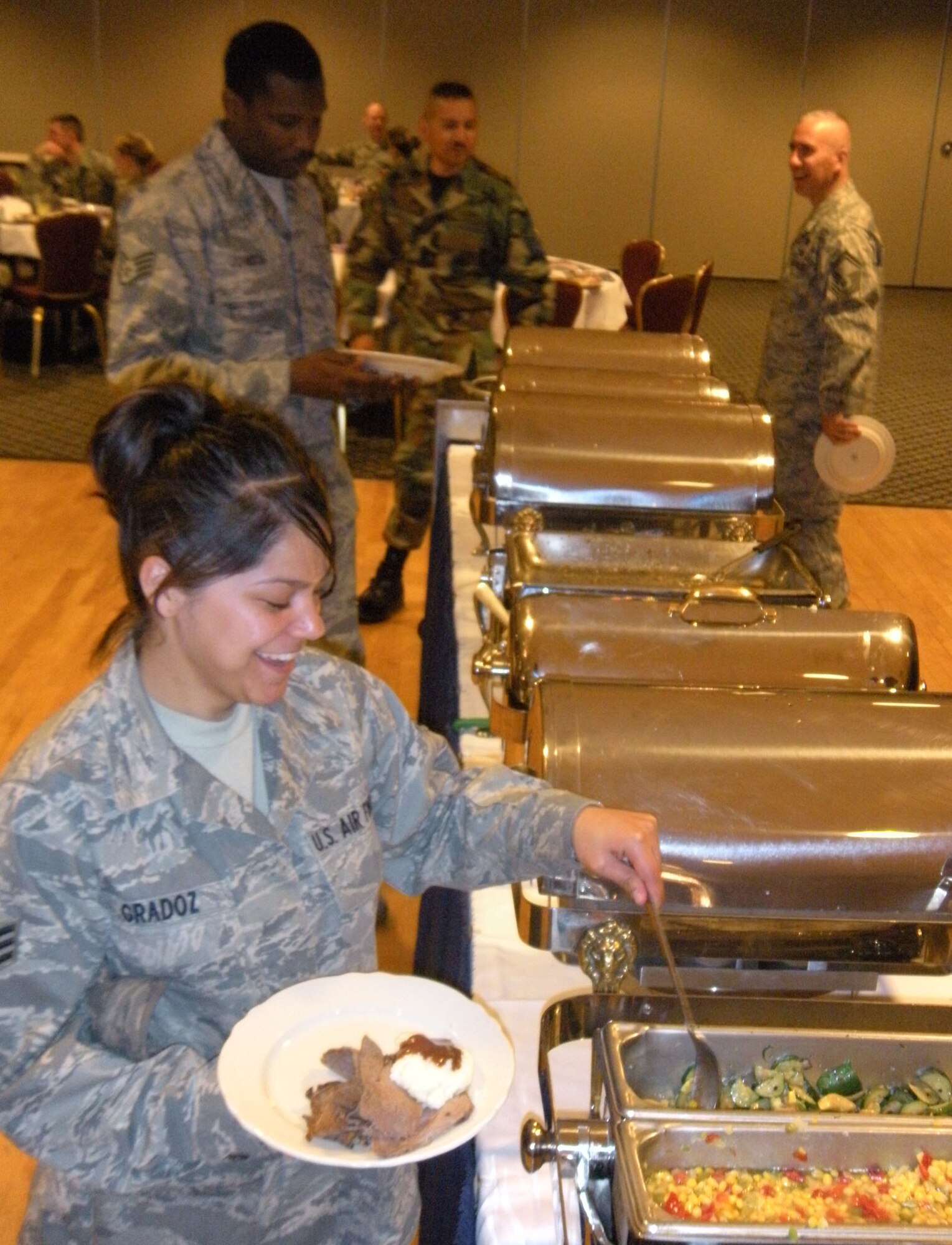 Senior Airman Sondra Gradoz, a food services technician with the 302nd Services Flight, takes advantage of funded meals April 10 at Peterson Air Force Base's club in Colorado. The base's Aragon dining facility recently closed for several months of renovation. All meals served to enlisted Reservists on an approved duty status are now available at multiple locations, including Peterson's club. Visit www.302aw.afrc.af.mil for more information on food locations on base for Reservists on orders. (U.S. Air Force photo/Staff Sgt. Stephen Collier)