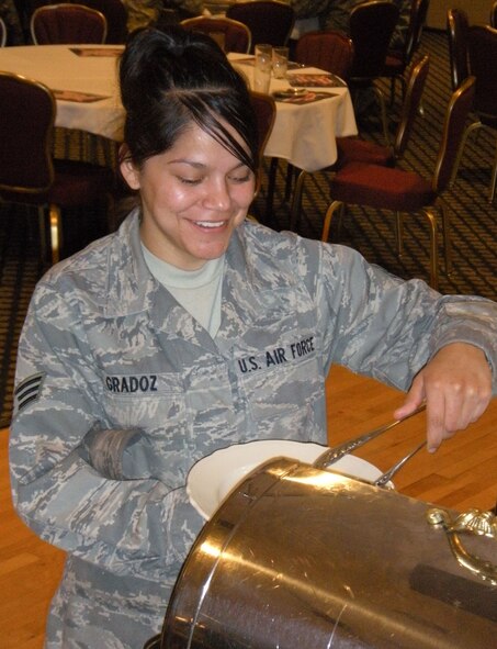 Senior Airman Sondra Gradoz, a food services technician with the 302nd Services Flight, takes advantage of funded meals April 10 at Peterson Air Force Base's club in Colorado. The base's Aragon dining facility recently closed for several months of renovation. All meals served to enlisted Reservists on an approved duty status are now available at multiple locations, including Peterson's club. Visit www.302aw.afrc.af.mil for more information on food locations on base for Reservists on orders. (U.S. Air Force photo/Staff Sgt. Stephen Collier)
