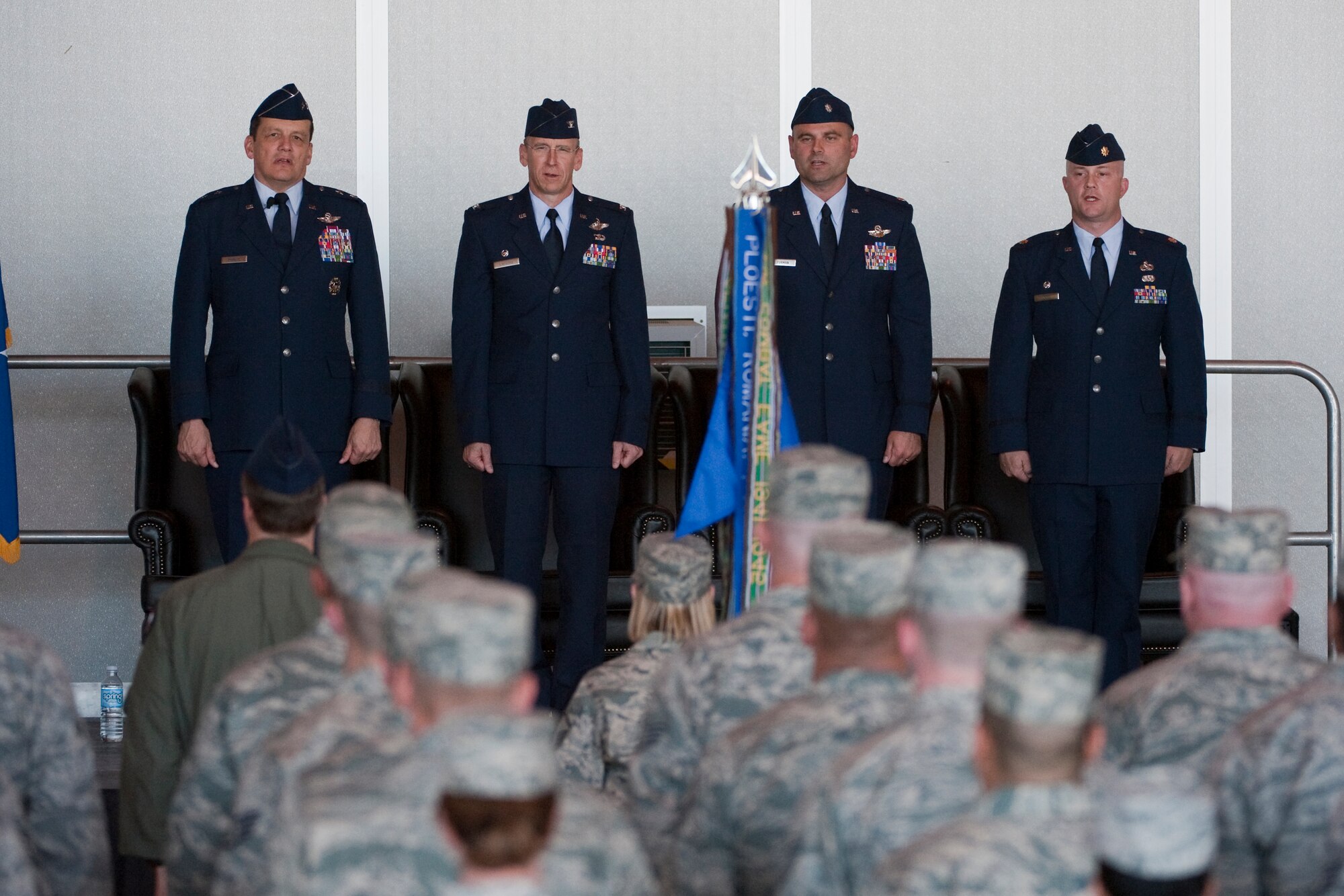 HOLLOMAN AIR FORCE BASE, N.M. -- U.S. Air force members sing the Air Force song during the 44th Fighter Group Activation ceremony April 9, 2010. The 44th Fighter Group traces its lineage to the famed World War II 44th Bombardment Group (Heavy) originally activated in January 1941 at MacDill Army Air Field in Tampa, Fla., and flew the then state of the art B-24 Liberator. Sixty-nine years later, the 44th Fighter Group is the only Air Force Reserve organization to be selected to fly the U.S. Air Force's premier air superiority fighter, the F-22 Raptor. (U.S. Air Force photo by Staff Sgt. Joe Laws / Released)