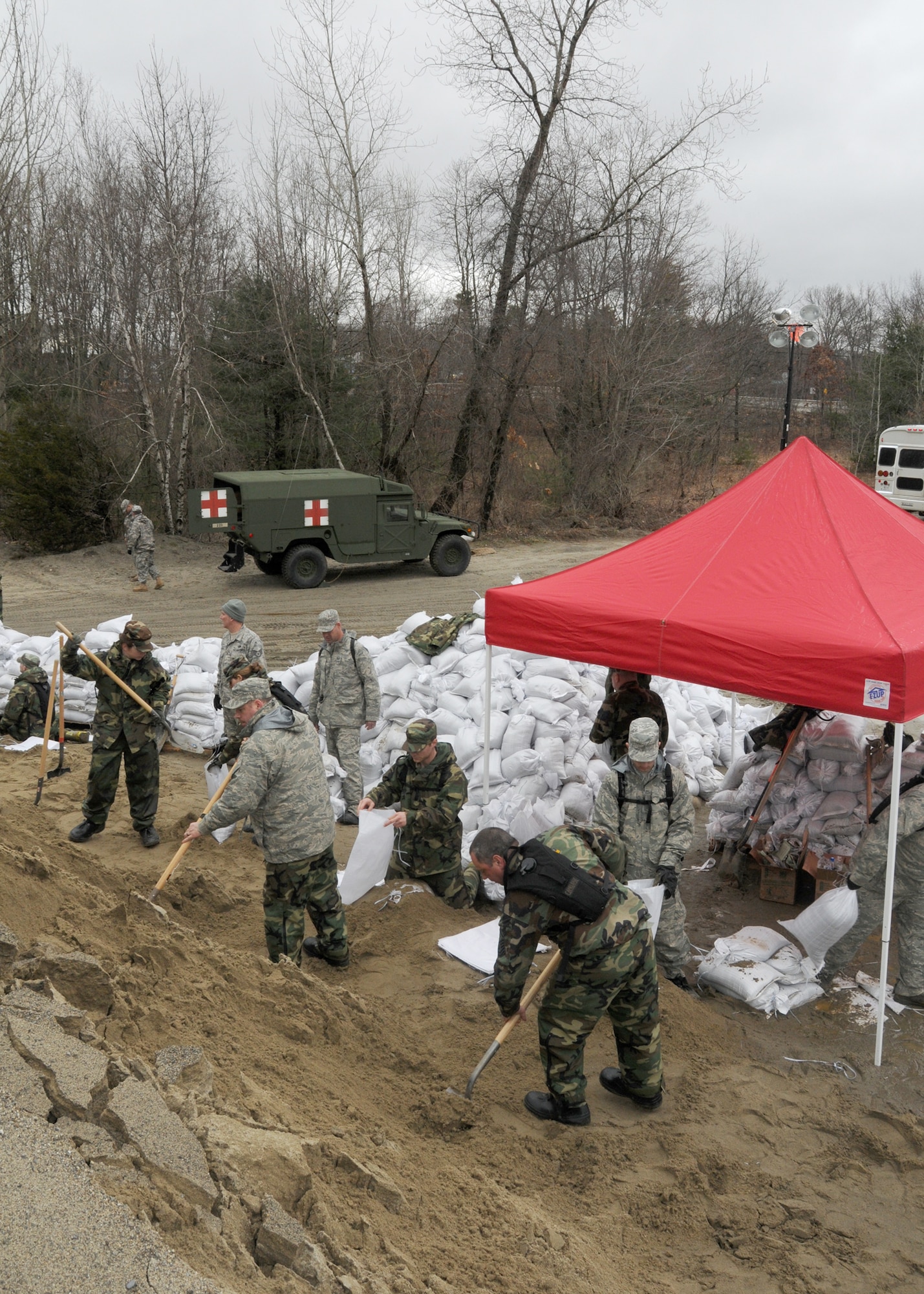 Members of the 104th Fighter Wing, Massachusetts Air National Guard, activated in support of Operation RISING WATER, fill thousands of sandbags on March 31, 2010 to be used in impacted areas threatened by flooding during recent rain storms.
