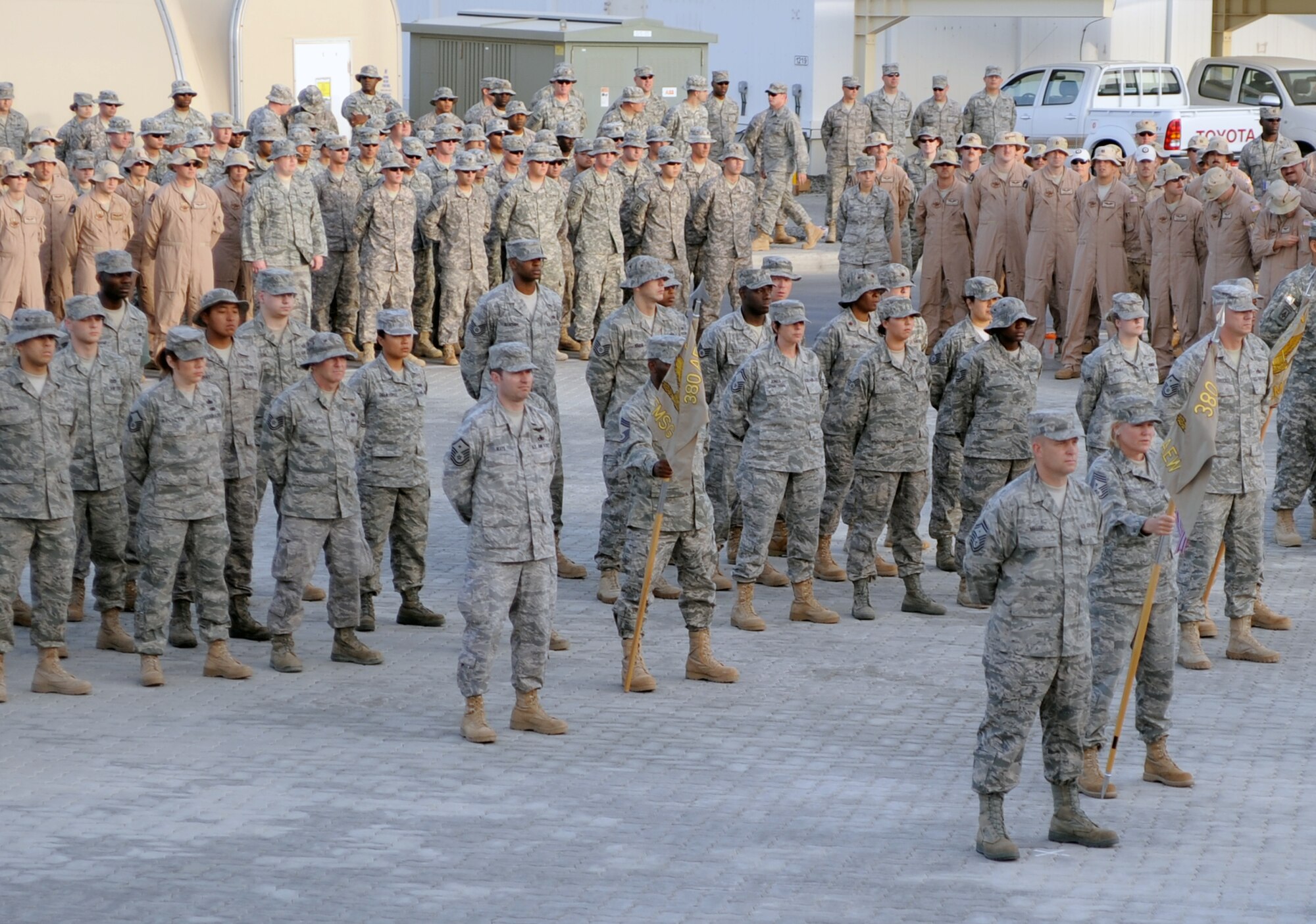 Airmen from the 380th Air Expeditionary Wing participate in a retreat ceremony at a non-disclosed base in Southwest Asia on April 2, 2010. Each week, the 380th AEW pays tribute to the American flag and what it stands for by holding the wing-wide ceremony with various units leading the retreat each week. The 380th AEW is home to the KC-10 Extender, U-2 Dragon Lady, E-3 Sentry and RQ-4 Global Hawk aircraft. The wing is comprised of four groups and 12 squadrons and the wing's deployed mission includes air refueling, surveillance and reconnaissance in support of overseas contingency operations in Southwest Asia. The 380th AEW supports operations Iraqi Freedom and Enduring Freedom and the Combined Joint Task Force-Horn of Africa. (U.S. Air Force Photo/Master Sgt. Scott T. Sturkol/Released)