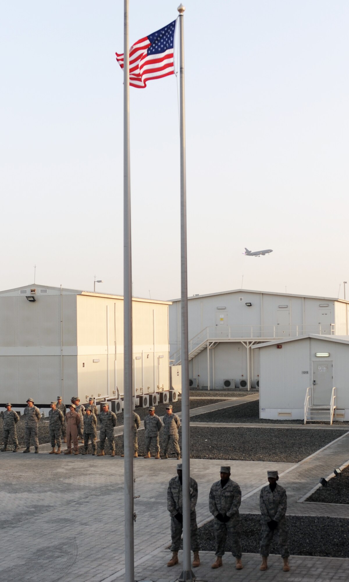 Airmen from the 380th Air Expeditionary Wing participate in a retreat ceremony at a non-disclosed base in Southwest Asia on April 2, 2010. Each week, the 380th AEW pays tribute to the American flag and what it stands for by holding the wing-wide ceremony with various units leading the retreat each week. The 380th AEW is home to the KC-10 Extender, U-2 Dragon Lady, E-3 Sentry and RQ-4 Global Hawk aircraft. The wing is comprised of four groups and 12 squadrons and the wing's deployed mission includes air refueling, surveillance and reconnaissance in support of overseas contingency operations in Southwest Asia. The 380th AEW supports operations Iraqi Freedom and Enduring Freedom and the Combined Joint Task Force-Horn of Africa. (U.S. Air Force Photo/Master Sgt. Scott T. Sturkol/Released)