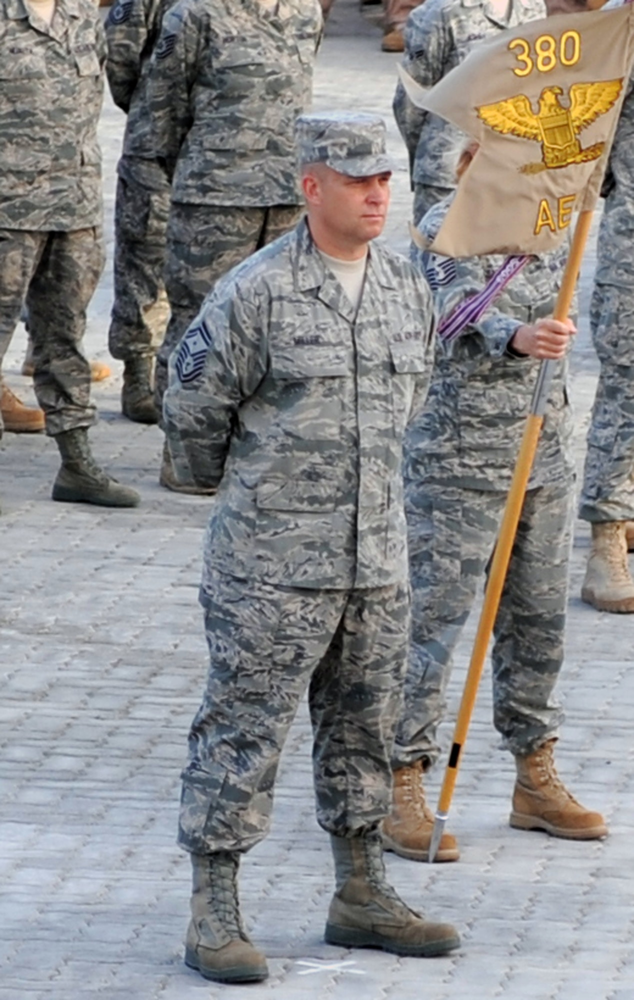 Senior Master Sgt. Mark Miller, first sergeant for the 380th Expeditionary Force Support Squadron, participates with other Airmen from the 380th Air Expeditionary Wing in a retreat ceremony at a non-disclosed base in Southwest Asia on April 2, 2010. Each week, the 380th AEW pays tribute to the American flag and what it stands for by holding the wing-wide ceremony with various units leading the retreat each week. The 380th AEW is home to the KC-10 Extender, U-2 Dragon Lady, E-3 Sentry and RQ-4 Global Hawk aircraft. The wing is comprised of four groups and 12 squadrons and the wing's deployed mission includes air refueling, surveillance and reconnaissance in support of overseas contingency operations in Southwest Asia. The 380th AEW supports operations Iraqi Freedom and Enduring Freedom and the Combined Joint Task Force-Horn of Africa. Sergeant Miller is deployed from the 133rd Test Squadron at Fort Dodge, Iowa, which is a geographically-separated unit of the 185th Air Refueling Wing in Sioux City, Iowa. Sergeant Miller's hometown is also Sioux City. (U.S. Air Force Photo/Master Sgt. Scott T. Sturkol/Released)