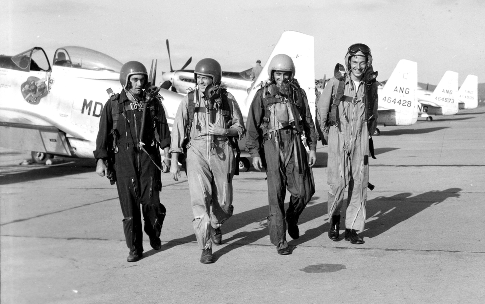 (Left to right) Guardian Angels pilots Capt. John F.R. Scott, 1st Lt. Malcolm Henry, 1st Lt. Bill Marriott and Capt. Jesse Mitchell on the flight line at Spaatz Field in Reading, Pa., following an airshow at Fort Indiantown Gap, Pa., in 1952. The Guardian Angels, a Maryland Air National Guard aerial demonstration team, flew from 1952 to 1953. (Released)