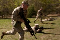 A Marine from Company G, 2nd Battalion, 25th Marine Regiment, 4th Marine Division, Marine Forces Reserve, practices combat rushing during a field exercise in Quantico, Va., April 10.