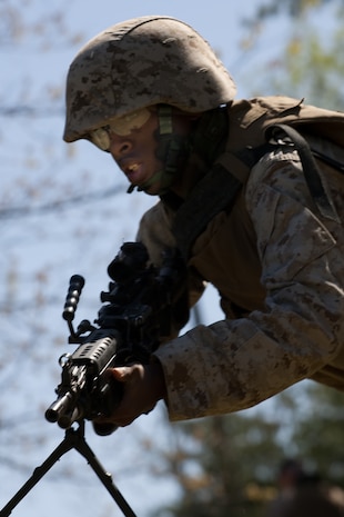 A Marine from 2nd Battalion, 25th Marine Regiment, 4th Marine Division, Marine Forces Reserve, practices combat rushing during a field exercise in Quantico, Va., April 10.