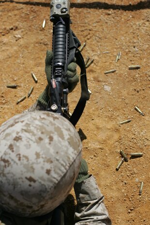 A Marine from 2nd Battalion, 25th Marine Regiment, 4th Marine Division, Marine Forces Reserve, fires his rifle during a field training exercise in Quantico, Va., April 10.