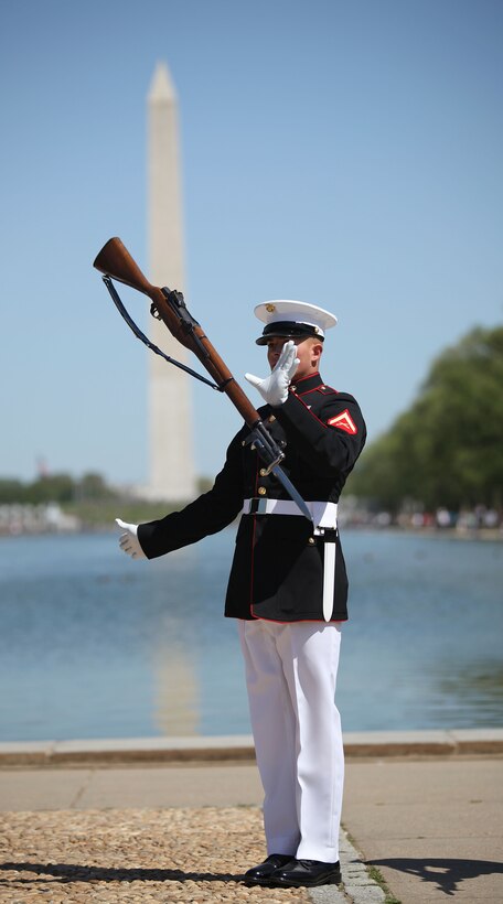 Lance Cpl. Joedy Petit Jr, a member of the Silent Drill Platoon, performs at the  U.S. Armed Forces Joint Ceremonial Drill Competition at the Licoln Memorial April 10. The Joint Drill Competition featured ceremonial drill units from each of the armed services.