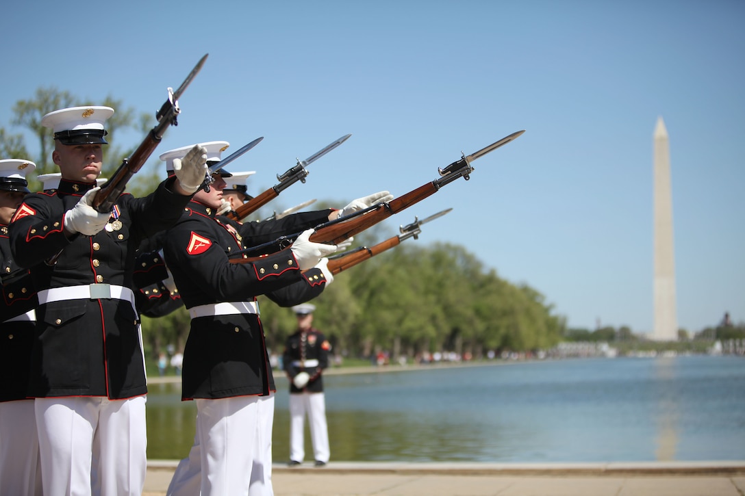 Lance Cpl. Michael Hintz and members of the Silent Drill Platoon pause for the bursting bomb portion of their drill sequence at the  U.S. Armed Forces Joint Ceremonial Drill Competition at the Licoln Memorial April 10. The Joint Drill Competition featured ceremonial drill units from each of the armed services.