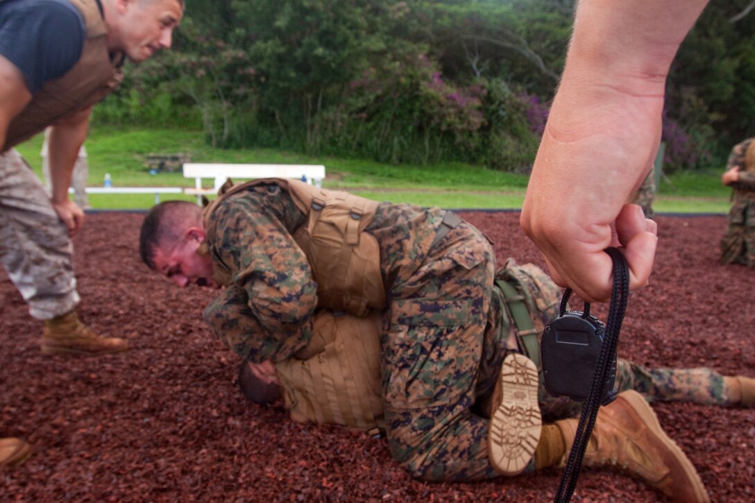 Marine Corps Martial Arts instructors and instructor trainers conduct belt progression training five days a week at 6 a.m. at Bordelon Field, Camp H.M. Smith, Hawaii. Sustainment training is conducted Tuesdays and Thursdays from 11 a.m. - 1 p.m.