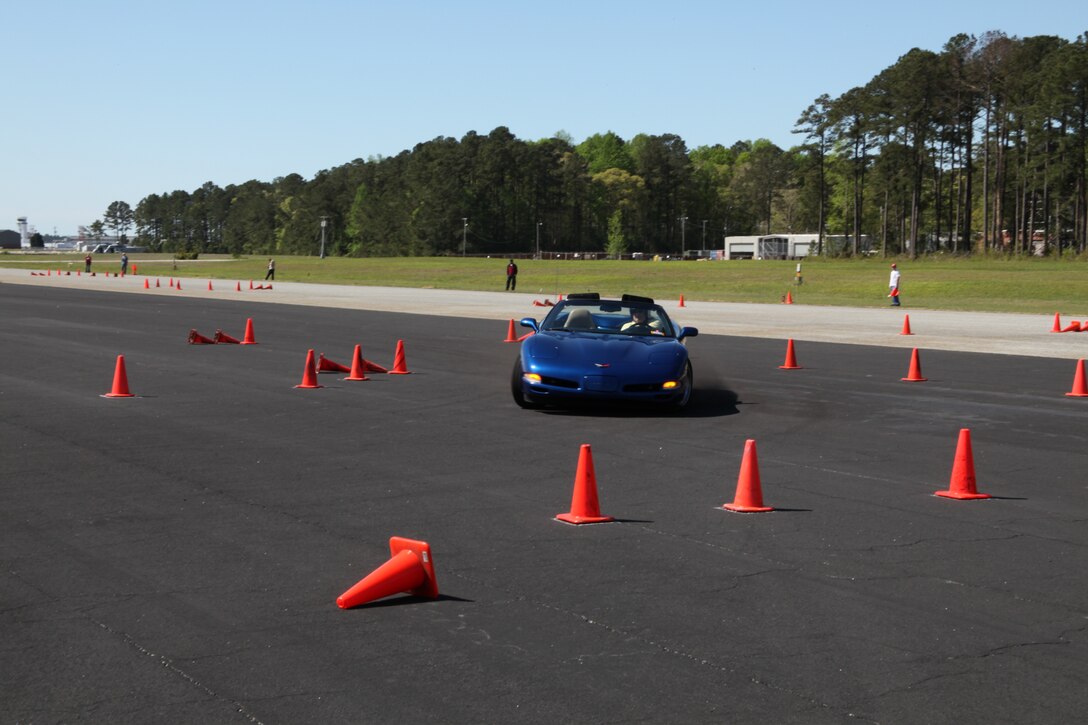 Col. Robert D. Clinton, the air station executive officer, speeds through a turn in his 2002 Chevrolet Corvette at an autocross event hosted by the Single Marine Program, April 11. The race, also hosted by the Sports Car Association of America, is the first of three events planned for Cherry Point this year.