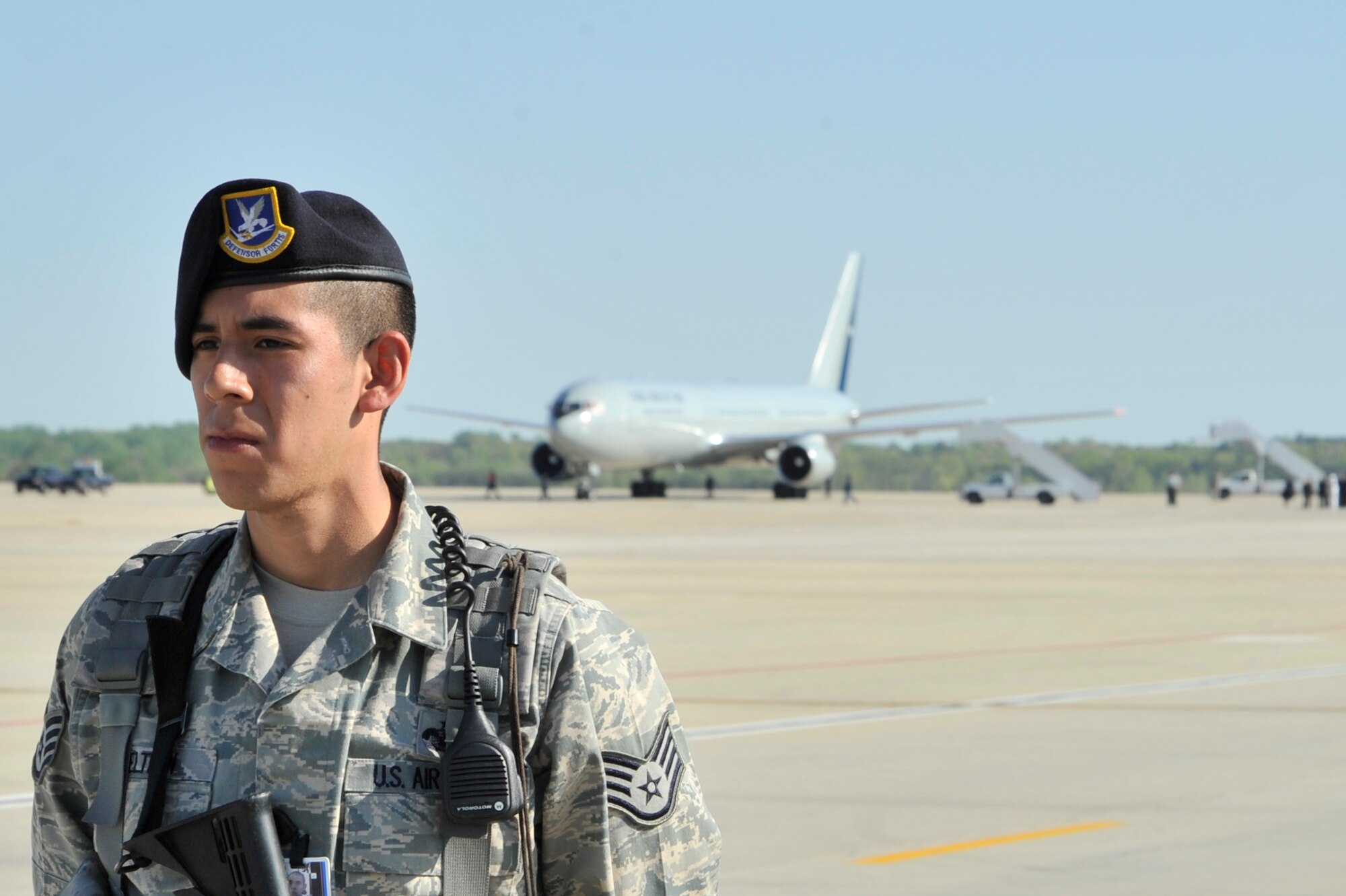 Staff Sgt. Mario Beltran, 316th Security Forces Squadron patrolman, scans for any threats while the motorcade for Chilean President Sebastia Pinera leaves the flight line April 11, 2010, at Joint Base Andrews, Md. The delegate landed at Andrews en route to the Nuclear Security Summit hosted by President Barack Obama in Washington, D.C., which is slated for Monday and Tuesday. The 316th Wing is leading operations to provide safe, effective, and efficient arrival and departure services for the invited guests transiting Andrews. (U.S. Air Force photo by Airman 1st Class Perry Aston) (Released)