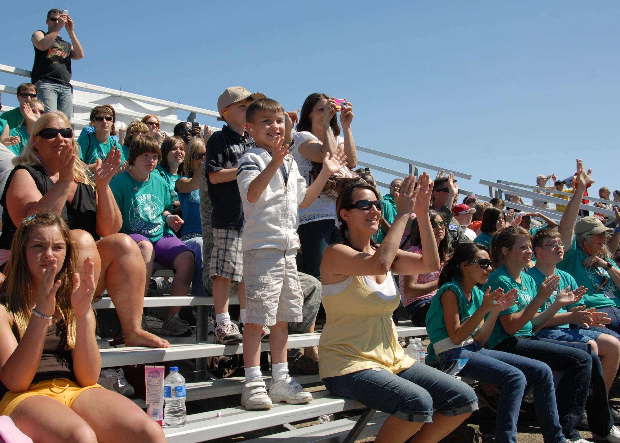 EGLIN AIR FORCE BASE, Fla. -- The crowd applaudes the Thunderbirds after their performance April 9 here.  The weekend airshow drew more than 70,000 people each day.  The T-birds headlined the show.  (U.S. Air Force photo/Samuel King Jr.)