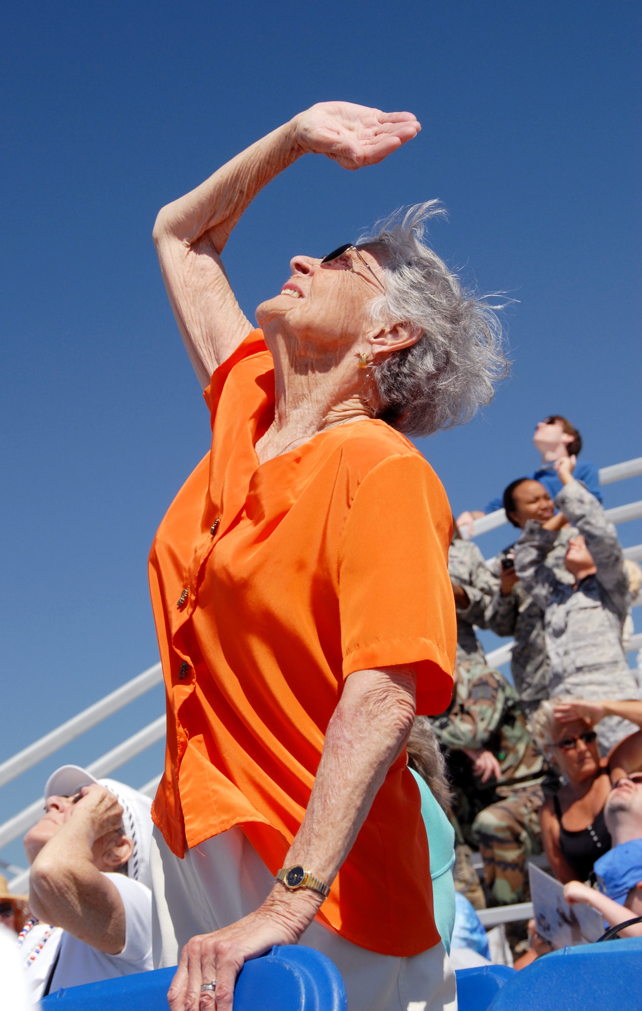 EGLIN AIR FORCE BASE, Fla. -- Kathleen Skaggs, 89-year-old widower from Bob Hope Village tries to find the Thunderbirds in the blue yonder over Eglin, April 9.  The weekend airshow drew more than 70,000 people each day.  The T-birds headlined the show.  (U.S. Air Force photo/Samuel King Jr.)