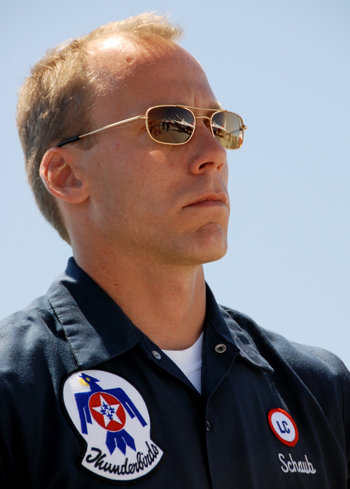 EGLIN AIR FORCE BASE, Fla. -- Tech. Sgt. John Schaub, Air Force Thunderbirds maintainer, looks out over the line of F-16s April 9 prior to the Special Needs/practice show here. The weekend's airshow drew more than 70,000 people each day.  The T-birds headlined the show.  (U.S. Air Force photo/Samuel King Jr.)