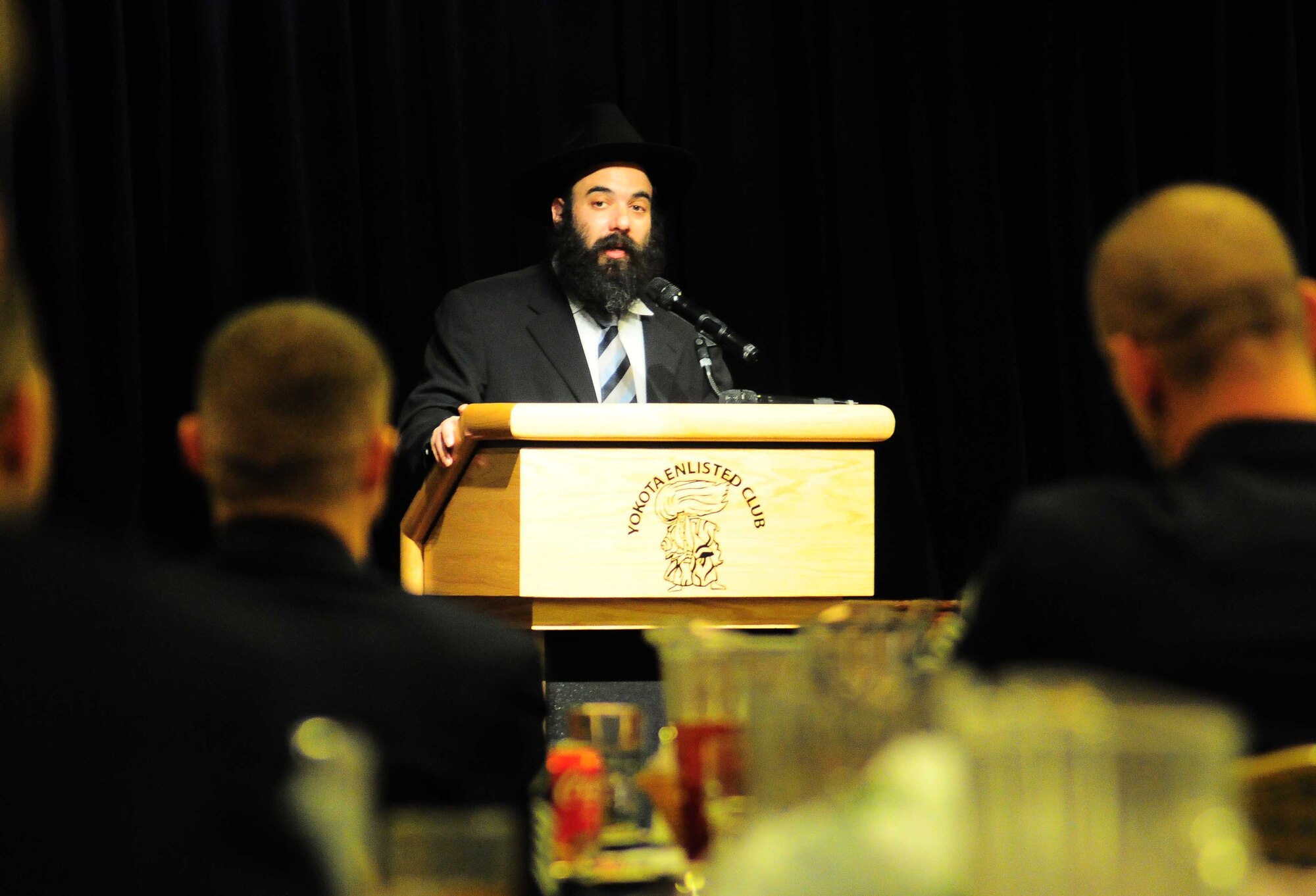 YOKOTA AIR BASE, Japan -- Rabbi Menachem Mendel Sudakevich, guest speaker at the Holocaust Days of Remembrance luncheon March 7, expressed the importance of using the unfortunate events of the past to improve the future.  The 2010 Holocaust Days of Remembrance Luncheon highlighted the strength and perseverance of the survivors while paying tribute to the victims of the Holocaust, as well as honoring the bravery of U.S. soldiers who helped defeat Nazi Germany and liberated Holocaust survivors. (U.S. Air Force photo/Airman 1st Class Devin Doskey)