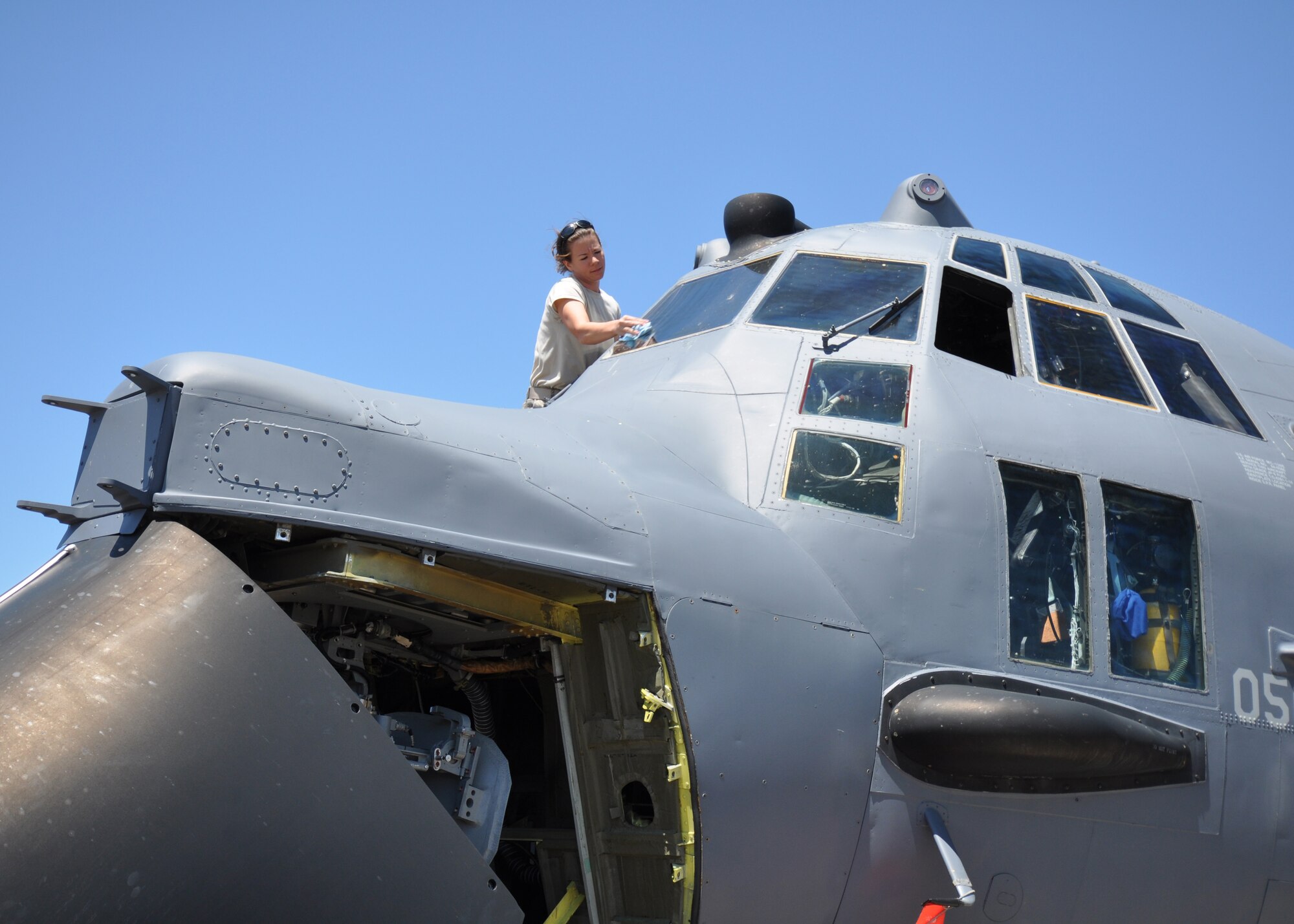 Air Force Reserve Staff Sgt. Tiffany Martinez, 919th Aircraft Maintenance Squadron, cleans the windscreen on a 919th Special Operations Wing MC-130E Combat Talon I aircraft parked on the Eglin Air Force Base tarmac April 9.  Duke Field reservists and their static display aircraft participated in Eglin's 75th Anniversary Open House and Air Show April 10-11 which attracted more than 70,000 daily spectators from the local area and beyond. (U.S. Air Force photo/Tech. Sgt. Samuel King Jr.)