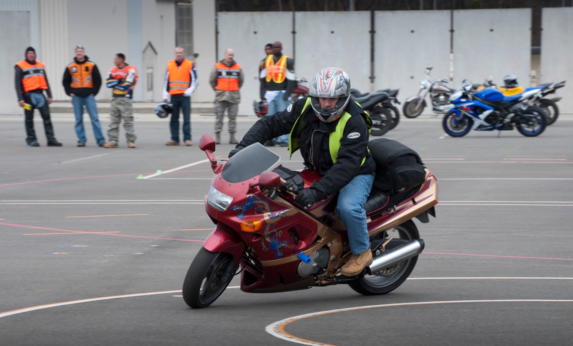 MISAWA AIR BASE, Japan -- U.S. Navy Chief Petty Officer Eric Holewinski, Basic Rider's Course lead instructor, demonstrates how to perform an exercise called "the box" at the motorcycle safety range April 1. Service members wishing to ride a motorcycle at Misawa Air Base must complete the two-day, 15-hour safety course accredited by the Motorcycle Safety Foundation. (U.S. Air Force photo/Staff Sgt. Samuel Morse)