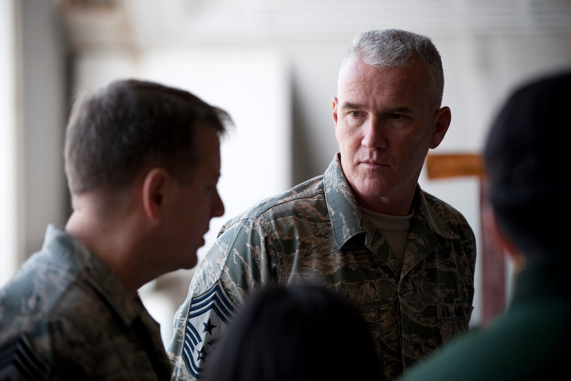 MISAWA AIR BASE, Japan -- Chief Master Sgt. Brook McLean, Pacific Air Forces command chief master sergeant, discusses the role of the Japan Air Self-Defense Force 3rd Air Wing and its F-2 fighter jets with Chief Master Sgt. Russell Hastings, 35th Fighter Wing command chief master sergeant, in a JASDF hardened aircraft shelter April 9. One reason Chief McLean visited Misawa Air Base was to learn more about the working relationship between the 35th Fighter Wing and their JASDF counterparts. (U.S. Air Force photo/Staff Sgt. Samuel Morse)