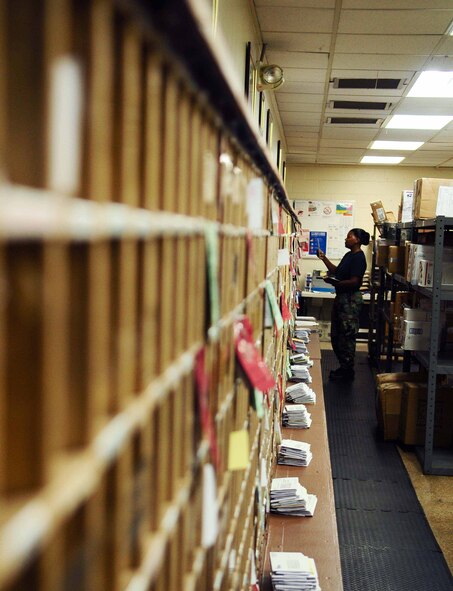 ANDERSEN AIR FORCE BASE, Guam ? Tech Sgt. Lashanda Santiago distributes daily mail here on April 9, 2010. Sergeant Santiago plays a key role in delivering more than 1 million pounds of mail per year to members of the Andersen team. (U.S. Air force photo by Airman 1st Class Jeffrey Schultze)