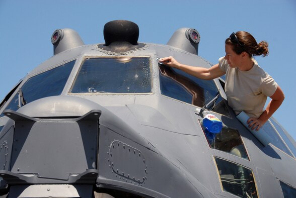 Air Force Reserve Staff Sgt. Tiffany Martinez, 919th Aircraft Maintenance Squadron, cleans the windscreen on a 919th Special Operations Wing MC-130E Combat Talon I aircraft parked on the Eglin Air Force Base tarmac April 9.  Duke Field reservists and their static display aircraft participated in Eglin's 75th Anniversary Open House and Air Show April 10-11 which attracted more than 70,000 daily spectators from the local area and beyond. (U.S. Air Force photo/Tech. Sgt. Samuel King Jr.)